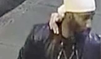 This still image from surveillance video made in Philadelphia and released by the Montgomery County, Pa., District Attorney shows a person of interest in the Aug. 22, 2018, homicide of Christina Carlin-Kraft. The model was found strangled to death in the bedroom of her apartment in the Philadelphia suburb of Ardmore, Pa. (Montgomery County District Attorney via AP)
