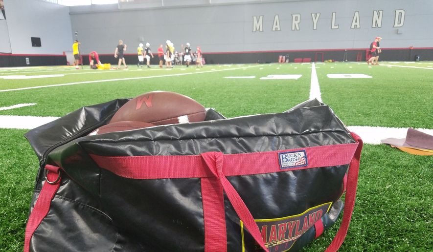 A bag of footballs rests on the sideline of the practice field inside Cole Field House at the University of Maryland as the Terrapins prepare for their 2018 season opener with a practice on Tuesday, Aug. 28, 2018. (Photo by Adam Zielonka / The Washington Times) ** FILE **