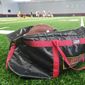 A bag of footballs rests on the sideline of the practice field inside Cole Field House at the University of Maryland as the Terrapins prepare for their 2018 season opener with a practice on Tuesday, Aug. 28, 2018. (Photo by Adam Zielonka / The Washington Times) ** FILE **