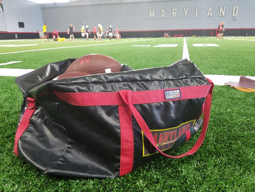 A bag of footballs rests on the sideline of the practice field inside Cole Field House at the University of Maryland as the Terrapins prepare for their 2018 season opener with a practice on Tuesday, Aug. 28, 2018. (Photo by Adam Zielonka / The Washington Times) **FILE**