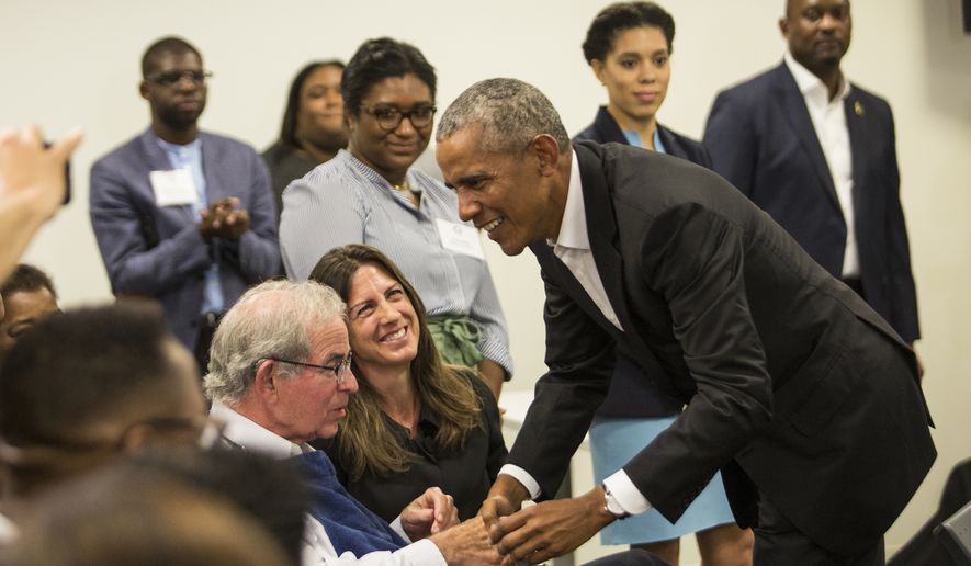 Former President Barack Obama meets with stakeholders and community members at the Obama Foundation's headquarters in Hyde Park, Tuesday, Aug. 28, 2018. The meeting was called to provide an update on the Obama Center's programming and a chance for the former president to thank the pre-selected group of community members. (Ashlee Rezin/Sun-Times/Chicago Sun-Times via AP)