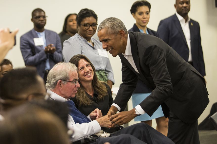 Former President Barack Obama meets with stakeholders and community members at the Obama Foundation's headquarters in Hyde Park, Tuesday, Aug. 28, 2018. The meeting was called to provide an update on the Obama Center's programming and a chance for the former president to thank the pre-selected group of community members. (Ashlee Rezin/Sun-Times/Chicago Sun-Times via AP)