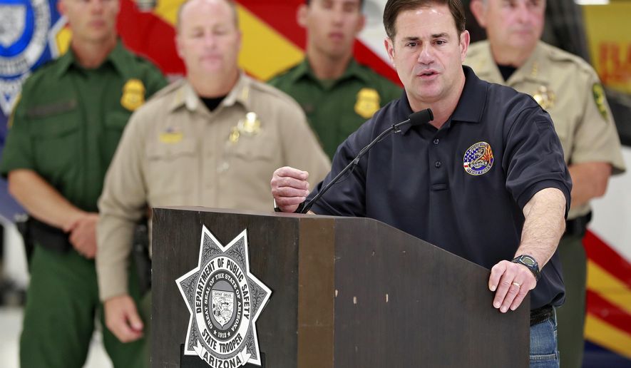 FILE - In this July 11, 2018, file photo, Arizona Gov. Doug Ducey, speaks at the Department of Public Safety aircraft hangar in Phoenix. The winner of Tuesday&#x27;s three-way democratic primary will seek to replace Incumbent Ducey in the November general election. (AP Photo/Matt York, File)