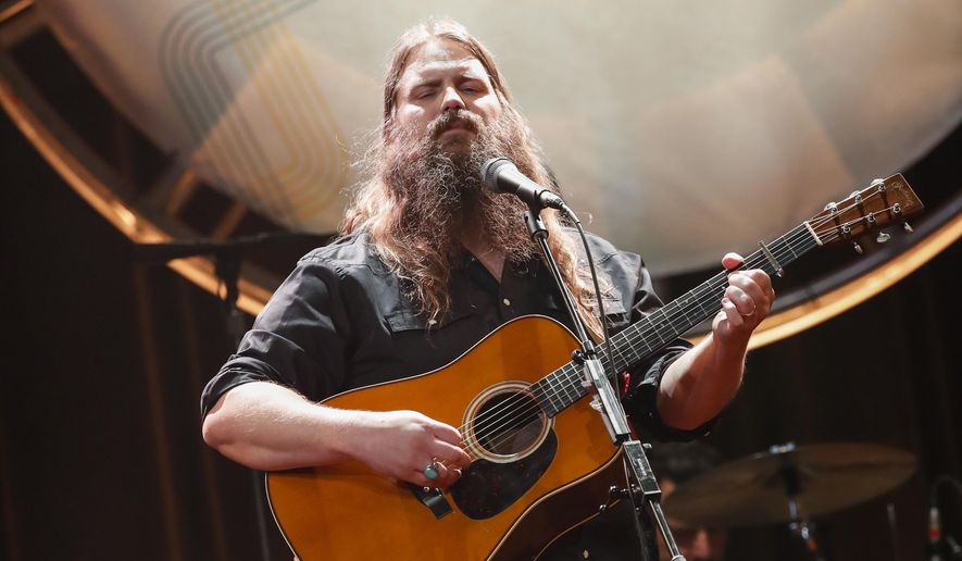 FILE - In this Aug. 22, 2018, file photo, Chris Stapleton performs at the 12th Annual ACM Honors at the Ryman Auditorium in Nashville, Tenn. Stapleton tops the list of finalists with five nominations for the 52nd annual Country Music Association Awards. The nominations were announced Tuesday, Aug. 28, from entertainer Luke Bryan’s restaurant and bar in Nashville on ABC’s “Good Morning America.” (Photo by Al Wagner/Invision/AP, File)