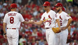 St. Louis Cardinals starting pitcher Luke Weaver (7) is removed by interim manager Mike Shildt (8) as shortstop Paul DeJong watches during the fourth inning of the team&#x27;s baseball game against the Washington Nationals on Thursday, Aug. 16, 2018, in St. Louis. (AP Photo/Jeff Roberson)