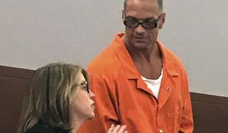 FILE - In this Aug. 17, 2017, file photo, Nevada death row inmate Scott Dozier, right, confers with Lori Teicher, a federal public defender involved in his case, during an appearance in Clark County District Court in Las Vegas. The Nevada Supreme has rescheduled oral arguments for Sept. 21, 2018, in Carson City on a challenge by three pharmaceutical companies of the use of their products for Dozier&#39;s execution. Prison officials want to reschedule Dozier&#39;s twice-postponed lethal injection for mid-November. (AP Photo/Ken Ritter, File)