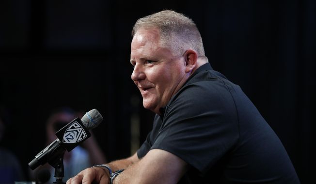 FILE - In this July 25, 2018, file photo, UCLA head coach Chip Kelly speaks at the Pac-12 Conference NCAA college football Media Day in Los Angeles. Kelly, who confounded opposing teams with his blur offense for the Oregon Ducks a few years back, returns to the Pac-12 this season as head coach of the UCLA Bruins. (AP Photo/Jae C. Hong, File)