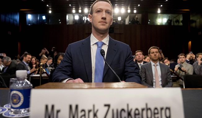 Facebook CEO Mark Zuckerberg testifies before a House Energy and Commerce hearing on April 10, addressing privacy and other issues. (Associated Press)