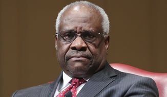 Supreme Court Associate Justice Clarence Thomas sits as he is introduced during an event at the Library of Congress, Thursday, Feb. 15, 2018, in Washington. (AP Photo/Pablo Martinez Monsivais) **FILE**