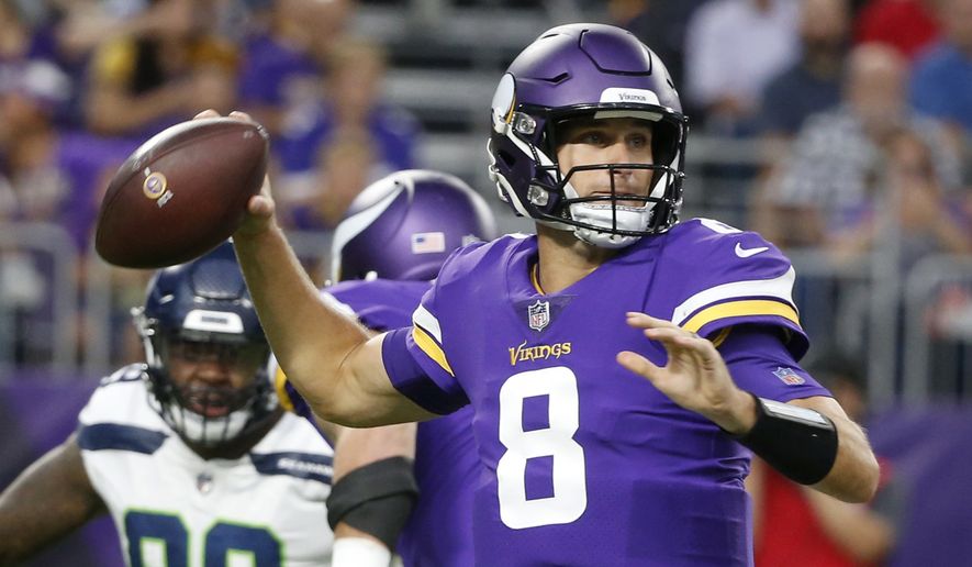 FILE - In this Friday, Aug. 24, 2018 file photo, Minnesota Vikings quarterback Kirk Cousins (8) throws a pass during the first half of an NFL preseason football game against the Seattle Seahawks in Minneapolis. The Minnesota Vikings have a new quarterback in Kirk Cousins and the same Super Bowl aspiration, after coming within one win of the big game last season. (AP Photo/Bruce Kluckhohn, File)