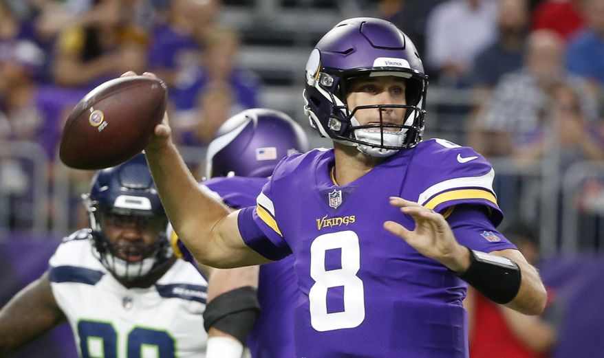 FILE - In this Friday, Aug. 24, 2018 file photo, Minnesota Vikings quarterback Kirk Cousins (8) throws a pass during the first half of an NFL preseason football game against the Seattle Seahawks in Minneapolis. The Minnesota Vikings have a new quarterback in Kirk Cousins and the same Super Bowl aspiration, after coming within one win of the big game last season. (AP Photo/Bruce Kluckhohn, File)