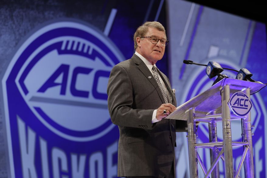 FILE - In this Wednesday, July 18, 2018 file photo,Atlantic Coast Conference commissioner John Swofford speaks during a news conference at the ACC NCAA college football media day in Charlotte, N.C. When Atlantic Coast Conference teams open the season this week, their games will air on several television platforms, from ABC and ESPNU to the CBS and Fox sports networks. A year from now, that list will also include the ACC’s own channel. Swofford said it could take four or five years to reap the channel’s full financial benefits. (AP Photo/Chuck Burton, File)