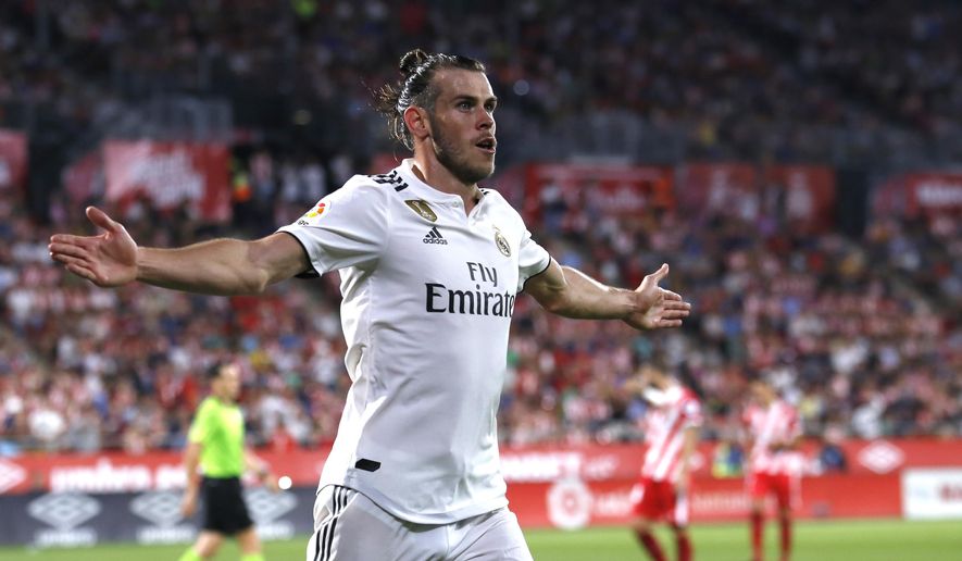 Real Madrid&#39;s Gareth Bale celebrates scoring his side&#39;s 3rd goal during the Spanish La Liga soccer match between Girona and Real Madrid at the Montilivi stadium in Girona, Sunday, Aug. 26, 2018. (AP Photo/Eric Alonso)