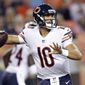 FILE - In this Aug. 18, 2018, file photo, Chicago Bears quarterback Mitchell Trubisky (10) throws against the Denver Broncos during the first half of a preseason NFL football game,  in Denver. The Bears spent the offseason loading up around Trubisky, hoping to accelerate their prized quarterback’s development and energize a franchise with four straight last-place finishes in the NFC North. (AP Photo/Jack Dempsey, File)
