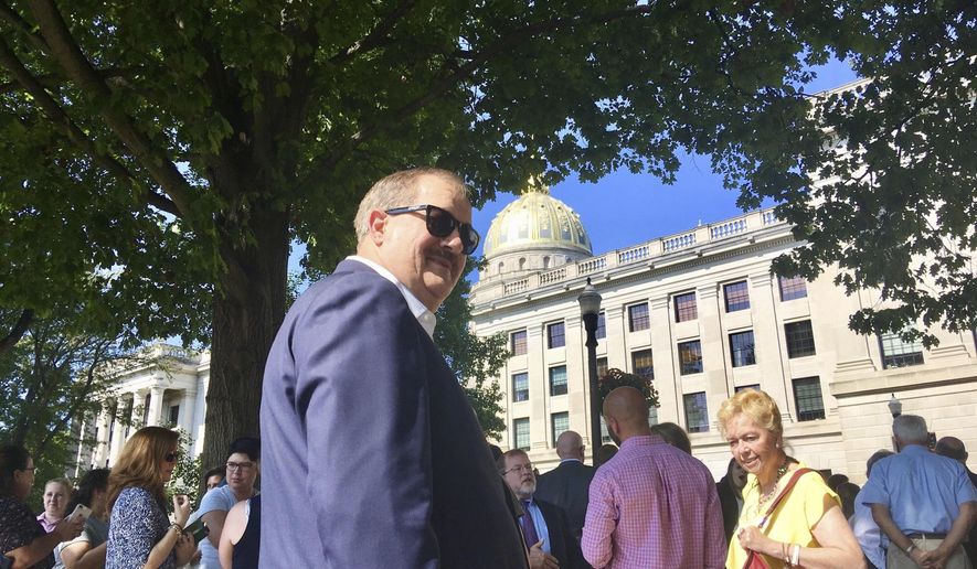 Former coal executive Don Blankenship waits outside the West Virginia Capitol on Wednesday, Aug. 29, 2018, after the Capitol was evacuated due to a fire alarm in Charleston, W.Va. The alarm interrupted a hearing for Blankenship in the state Supreme Court over whether he could be placed on the fall ballot in the U.S. Senate race. (AP Photo/John Raby)