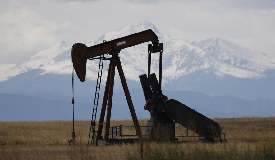 FILE - In this Friday, May 27, 2016, photo, a pump jack works off state highway 119 near Firestone, Colo. A contentious proposal to tightly restrict the location of new oil and gas wells in Colorado attracted more than enough petition signatures to qualify for the November ballot, election officials said Wednesday, Aug. 29, 2018. (AP Photo/David Zalubowski, File)