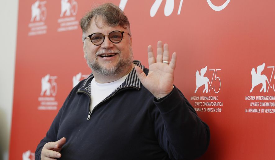 Jury President Guillermo del Toro poses for photographers at the photo call for the Jury at the 75th edition of the Venice Film Festival in Venice, Wednesday, Aug. 29, 2018. (AP Photo/Kirsty Wigglesworth)