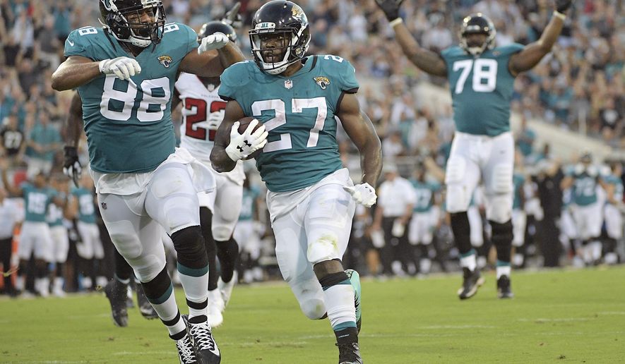 FILE - In this Saturday, Aug. 25, 2018 file photo, Jacksonville Jaguars running back Leonard Fournette (27) runs for a 21-yard touchdown against the Atlanta Falcons, next to tight end Austin Seferian-Jenkins (88), as offensive tackle Jermey Parnell (78) signals the score during the first half of an NFL preseason football game in Jacksonville, Fla. Jacksonville Jaguars running back Leonard Fournette lost more than 15 pounds this offseason in an effort to “take it back” to his college days. He now expects his second NFL season to look a lot like his sophomore year at LSU.  (AP Photo/Phelan M. Ebenhack, File)
