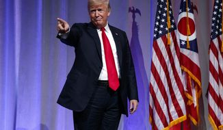 FILE - In this Aug. 24, 2018 file photo, President Donald Trump arrives to speak at the Ohio Republican Party State Dinner in Columbus, Ohio. CNN is sticking by a story casting doubt on President Donald Trump’s claim that he did not have prior knowledge of a June 2016 meeting with a Russian lawyer to get damaging information on Hillary Clinton, his Democratic rival at the time. (AP Photo/Evan Vucci, File)