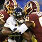 Washington Redskins linebackers Ryan Anderson (52) and Shaun Dion Hamilton (51) tackle Baltimore Ravens running back Kenneth Dixon who was rushing the ball in the first half of a preseason NFL football game Thursday, Aug. 30, 2018, in Baltimore. (AP Photo/Nick Wass) ** FILE **