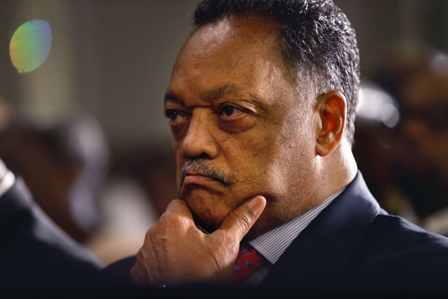 Rev. Jesse Jackson listens as Democratic vice presidential candidate Sen. Tim Kaine, D-Va., speaks to the Progressive National Baptist Convention in New Orleans, Thursday, Aug. 11, 2016. (AP Photo/Gerald Herbert)