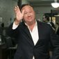 In this April 19, 2017, file photo, Alex Jones, a right-wing radio host and conspiracy theorist, arrives at the courthouse in Austin, Texas. (Jay Janner/Austin American-Statesman via AP, File)