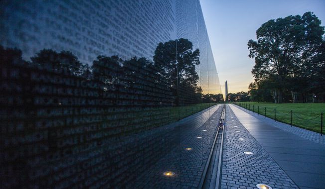 The Vietnam Veterans Memorial is seen in Washington, early Thursday, Aug. 30, 2018. (AP Photo/J. Scott Applewhite)