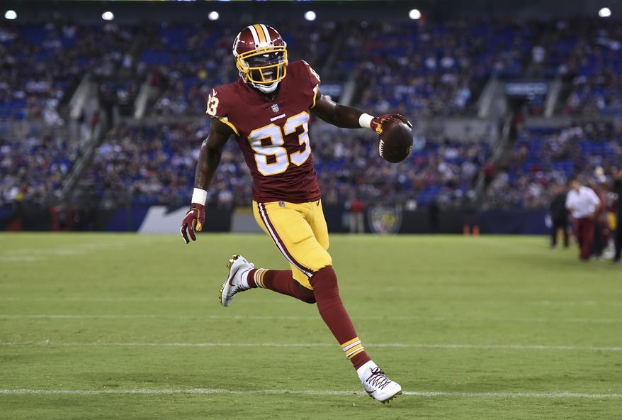 Washington Redskins wide receiver Brian Quick reacts as he scores a touchdown in the first half of a preseason NFL football game against the Baltimore Ravens, Thursday, Aug. 30, 2018, in Baltimore. (AP Photo/Gail Burton) ** FILE **