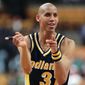 Indiana Pacers Reggie Miller taunts some front-row Boston Celtics fans who had been jeering him all game moments after he nailed a 3-point jump shot to win against the Celtics, 122-119, in overtime Monday night, Feb. 26, 1996, in Boston. Miller led the Pacers with 39 points. (AP Photo/Elise Amendola) ** FILE **