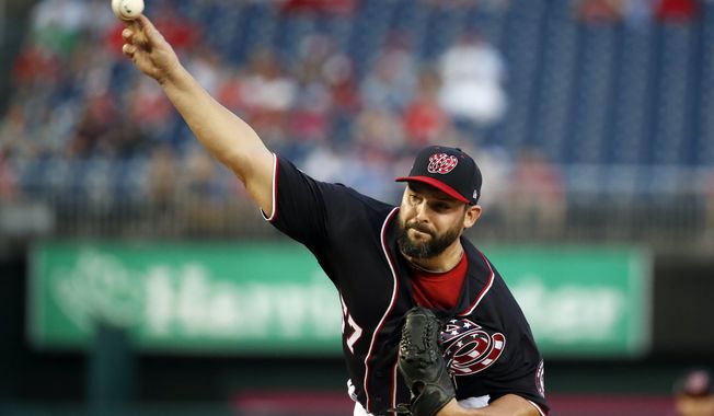 Washington Nationals starting pitcher Tanner Roark throws during the first inning of a baseball game against the Milwaukee Brewers at Nationals Park, Friday, Aug. 31, 2018, in Washington. (AP Photo/Alex Brandon)
