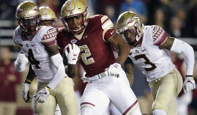 FILE - In this Oct. 27, 2017, file photo, Boston College running back AJ Dillon (2) carries the ball during the first half of an NCAA college football game against Florida State in Boston. Among things to watch in the ACC this week: The replacement for 2016 Heisman Trophy winner Lamar Jackson at Louisville faces a tall task with an opener against top-ranked Alabama, and Boston College’s AJ Dillon looks to keep rolling after a breakout freshman season. (AP Photo/Michael Dwyer, File)