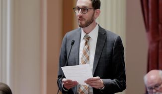 State Sen. Scott Wiener, D-San Francisco, addresses the state Senate, Thursday, Aug. 30, 2018, in Sacramento, Calif. The Assembly approved Wiener&#39;s net neutrality bill seeking to revive regulations repealed last year by the Federal Communications Commission that prevented internet companies from exercising more control over what people watch and see on the internet. (AP Photo/Rich Pedroncelli)