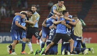 Players of Argentina&#39;s Atletico Tucuman celebrate after losing 0-1 against Colombia&#39;s Atletico Nacional in a Copa Libertadores round of sixteen soccer match in Medellin, Colombia, Tuesday, Aug. 28, 2018. Atletico Tucuman won 2-1 on aggregate and qualified for the quarterfinals. (AP Photo/Luis Benavides)