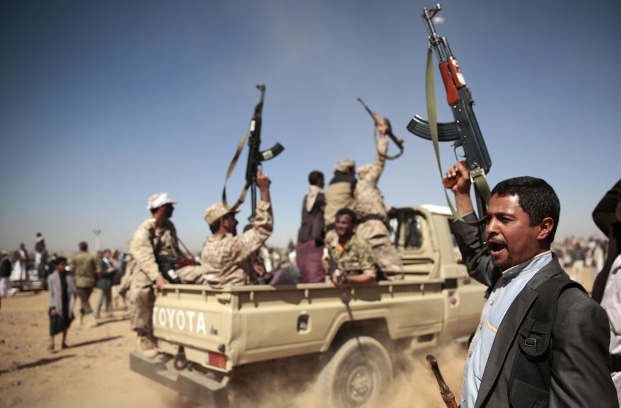 In this Jan. 3, 2017, file photo, a tribesman loyal to Yemen's Shiite Houthi rebels, right, chants slogans during a gathering aimed at mobilizing more fighters into battlefronts to fight pro-government forces in several Yemeni cities, in Sanaa, Yemen. (AP Photo/Hani Mohammed, File)