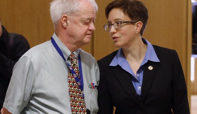 FILE - In this Feb. 13, 2015, file photo, Oregon Senate President Peter Courtney, left, and Speaker of the House Tina Kotek confer at the Capitol in Salem, Ore. Oregon's Legislature is battling an effort by the state's labor commissioner, Brad Avakian, to investigate sexual harassment in the state Capitol, saying he lacks jurisdiction and would violate privacy of people who came forward under assurances their identities wouldn't be disclosed. (AP Photo/Timothy J. Gonzalez, File)