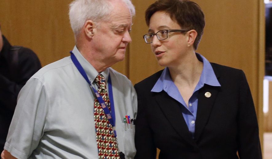 FILE - In this Feb. 13, 2015, file photo, Oregon Senate President Peter Courtney, left, and Speaker of the House Tina Kotek confer at the Capitol in Salem, Ore. Oregon's Legislature is battling an effort by the state's labor commissioner, Brad Avakian, to investigate sexual harassment in the state Capitol, saying he lacks jurisdiction and would violate privacy of people who came forward under assurances their identities wouldn't be disclosed. (AP Photo/Timothy J. Gonzalez, File)