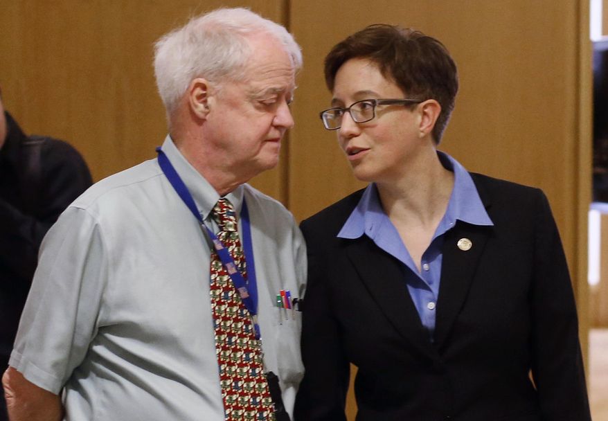 FILE - In this Feb. 13, 2015, file photo, Oregon Senate President Peter Courtney, left, and Speaker of the House Tina Kotek confer at the Capitol in Salem, Ore. Oregon's Legislature is battling an effort by the state's labor commissioner, Brad Avakian, to investigate sexual harassment in the state Capitol, saying he lacks jurisdiction and would violate privacy of people who came forward under assurances their identities wouldn't be disclosed. (AP Photo/Timothy J. Gonzalez, File)