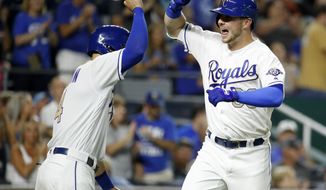 Kansas City Royals&#39; Ryan O&#39;Hearn, right, celebrates with Alex Gordon after hitting a two-run home run during the eighth inning of a baseball game against the Baltimore Orioles on Friday, Aug. 31, 2018, in Kansas City, Mo. (AP Photo/Charlie Riedel)