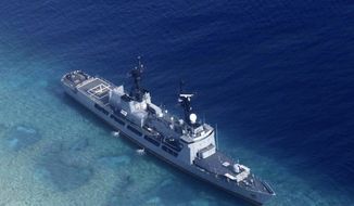In this photo provided by the Armed Forces of the Philippines, the Philippine Navy ship BRP Gregorio del Pilar is seen after it ran aground during a routine patrol Wednesday, Aug. 29, 2018, in the vicinity of Half Moon Shoal, which is called Hasa Hasa in the Philippines, off the disputed Spratlys Group of islands in the South China Sea, adding that its crew was unhurt, the military said. Two officials say Friday, Aug. 31, 2018, the Philippines has notified China about a Philippine navy frigate that ran aground in the South China Sea to avoid any misunderstanding because the incident happened near a hotly disputed region. The barren shoal is on the eastern edge of the disputed Spratly archipelago. (Armed Forces of the Philippines via AP)