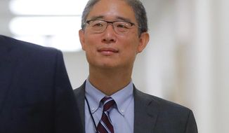 In this Aug. 28, 2018, file photo, Justice Department official Bruce Ohr arrives for a closed hearing of the House Judiciary and House Oversight committees on Capitol Hill in Washington. A former British spy told Ohr, a senior Justice Department lawyer, at a breakfast meeting on July 30, 2016, that Russian intelligence believed it had Donald Trump “over a barrel,” according to multiple people familiar with the encounter. (AP Photo/Pablo Martinez Monsivais)