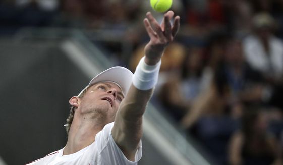 Kevin Anderson, of South Africa, serves to Denis Shapovalov, of Canada, during the third round of the U.S. Open tennis tournament, Friday, Aug. 31, 2018, in New York. (AP Photo/Julio Cortez)