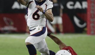 Denver Broncos quarterback Chad Kelly throws under pressure from Arizona Cardinals defensive end Alec James during the first half of a preseason NFL football game Thursday, Aug. 30, 2018, in Glendale, Ariz. (AP Photo/Rick Scuteri)