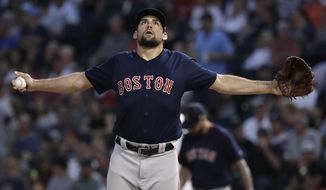 Boston Red Sox starting pitcher Nathan Eovaldi stretches during the first inning of the team&#x27;s baseball game against the Chicago White Sox, Friday, Aug. 31, 2018, in Chicago. (AP Photo/Nam Y. Huh)