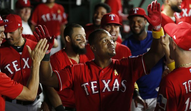 Texas Rangers&#x27; Adrian Beltre (29) gets congratulated after hitting a solo home run against the Minnesota Twins during the fourth inning of a baseball game, Saturday, Sept. 1, 2018, in Arlington, Texas. (AP Photo/Michael Ainsworth)