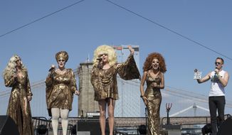 Neil Patrick Harris, right, appears on stage along Lady Bunny, center, and other performers during Wigstock, Saturday, Sept. 1, 2018, in New York. The 1980s festival, an impromptu creation of unruly patrons in drag who stumbled out of an East Village club at about 2 a.m. to improvise for homeless people in garbage-strewn, rat-infested Tompkins Square Park, was revived at New York City&#39;s Pier 17. (AP Photo/Mary Altaffer)
