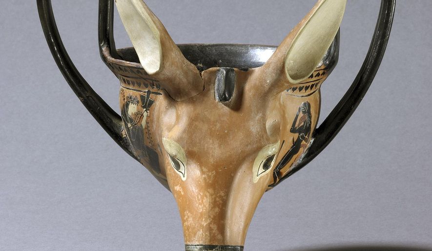 In this July 27, 2018, photo provided by the British Museum of London, a drinking vessel shaped like a donkey head and believed to date to 520-500 B.C. is depicted. A new exhibition at the Harvard Art Museums explores how the ancients literally partied in beast mode, with cups shaped like the beings they revered the most: animals. (British Museum/Harvard Art Museums via AP)