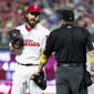 Philadelphia Phillies relief pitcher Austin Davis, left, talks with umpire Marty Foster, right, during the eighth inning of a baseball game against the Chicago Cubs, Saturday, Sept. 1, 2018, in Philadelphia. Umpire Joe West confiscated a card from Davis in the eighth inning of Philadelphia&#39;s 7-1 loss. Davis and Phillies manager Gabe Kapler said he was using the card merely for information on the Cubs hitters. But West said it was illegal under Rule 6.02(c)(7), which states that the pitcher shall not have on his person, or in his possession, any foreign substance. (AP Photo/Chris Szagola)