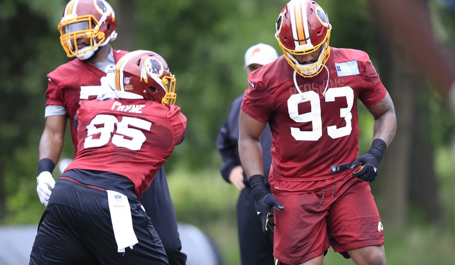 Redskins defensive guard Jonathan Allen (93) is up against Daron Payne (95) during the NFL football team&#39;s full practice session at the Redskins Park in Ashburn, Va., Wednesday, May 30, 2018. (AP Photo/Manuel Balce Ceneta)