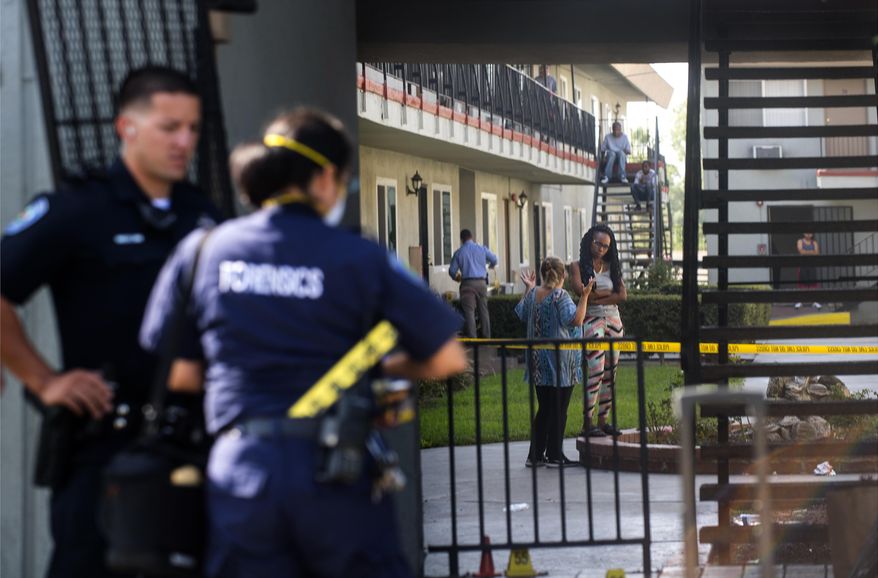 Authorities continue to investigate a shooting, Monday, Sept. 3, 2018, at an apartment complex in San Bernardino, Calif., that occurred during a dice game on Sunday night. (Cindy Yamanaka/The Orange County Register via AP)