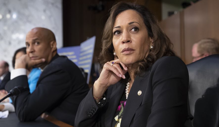 Sen. Kamala Harris, D-Calif., and Sen. Cory Booker, D-N.J., left, pause as protesters disrupt the confirmation hearing of President Donald Trump&#39;s Supreme Court nominee, Brett Kavanaugh, on Capitol Hill in Washington, Tuesday, Sept. 4, 2018. (AP Photo/J. Scott Applewhite) **FILE**